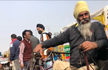 Specially-abled man cycles 450 km to support farmers agitation at Singhu border